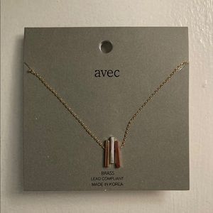 Silver/brass/gold bar necklace.